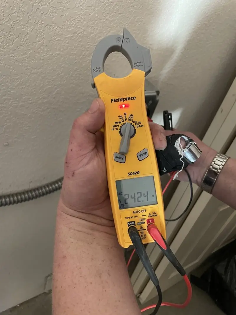 Voltage testing with clamp meter during Electrical Installation Services in Altamonte Springs